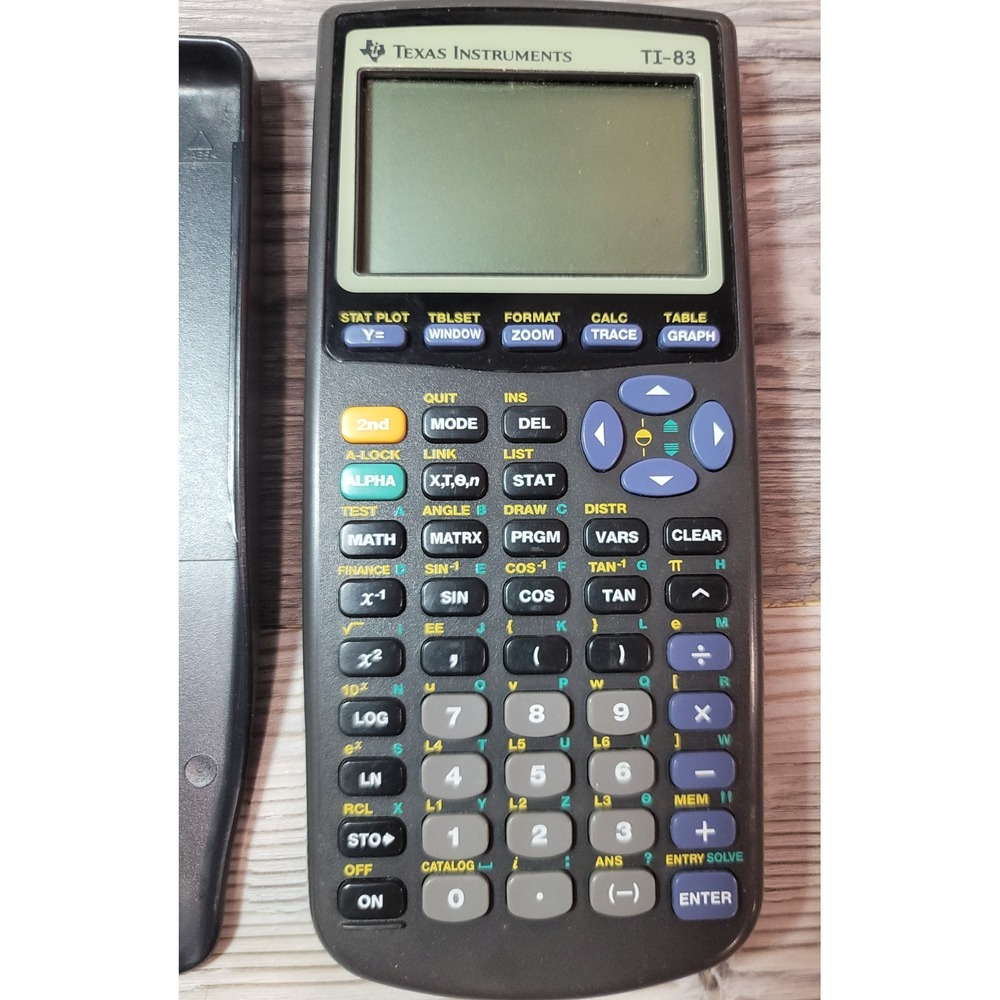 GENUINE Texas Instruments TI-83 Plus Calculator in Case (TESTED) scratches back